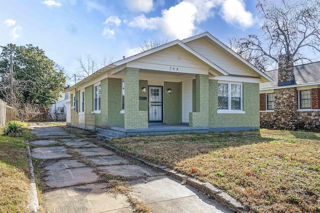 bungalow-style house featuring a front yard and a porch