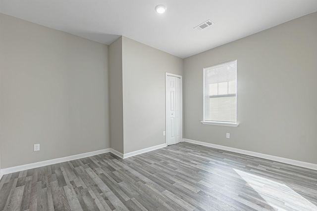 unfurnished room with light hardwood / wood-style flooring