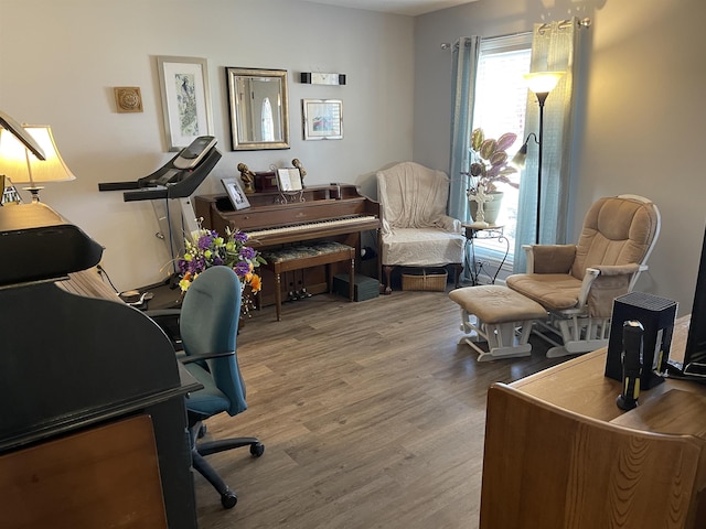 living area with hardwood / wood-style floors