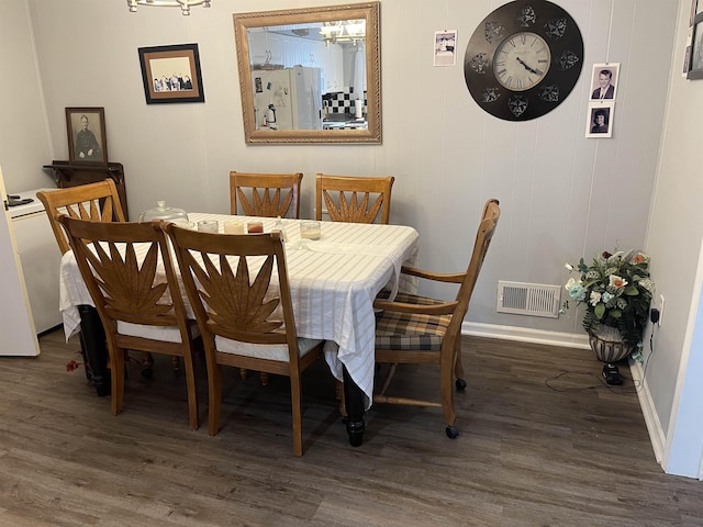 dining area with dark wood-type flooring