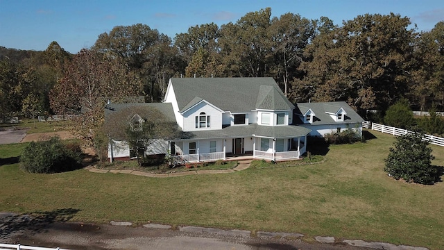 view of front of house featuring a front yard and covered porch