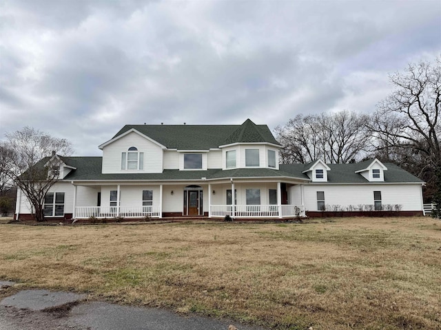 view of front of property with a porch and a front yard