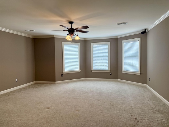 carpeted empty room with ornamental molding and ceiling fan