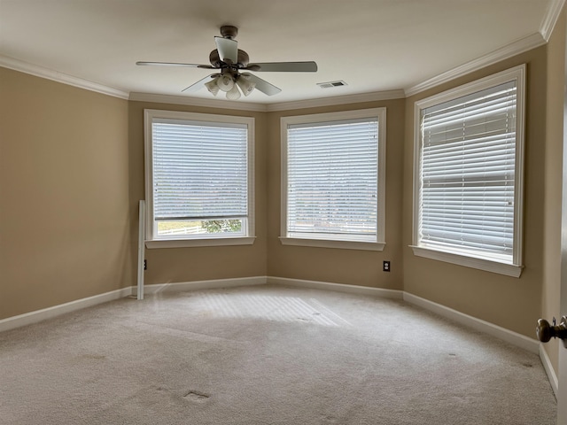 unfurnished room with ceiling fan, ornamental molding, and light carpet