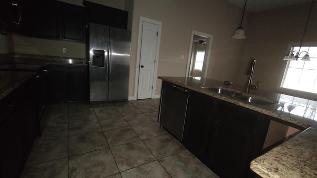 kitchen with black dishwasher, dark cabinetry, a sink, and stainless steel fridge with ice dispenser