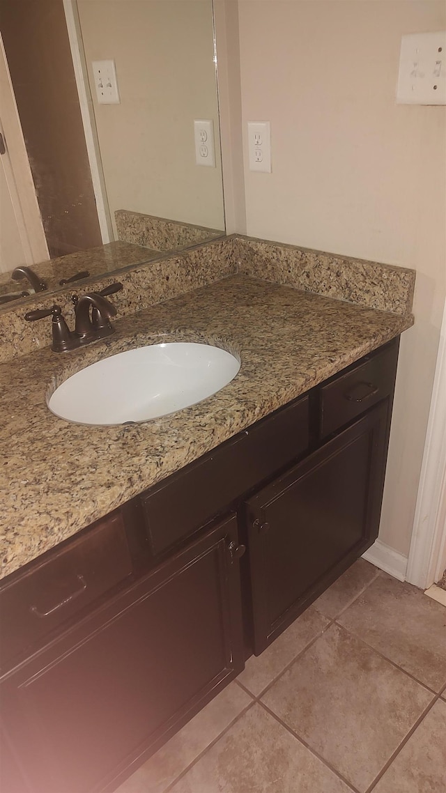 bathroom with vanity and tile patterned floors