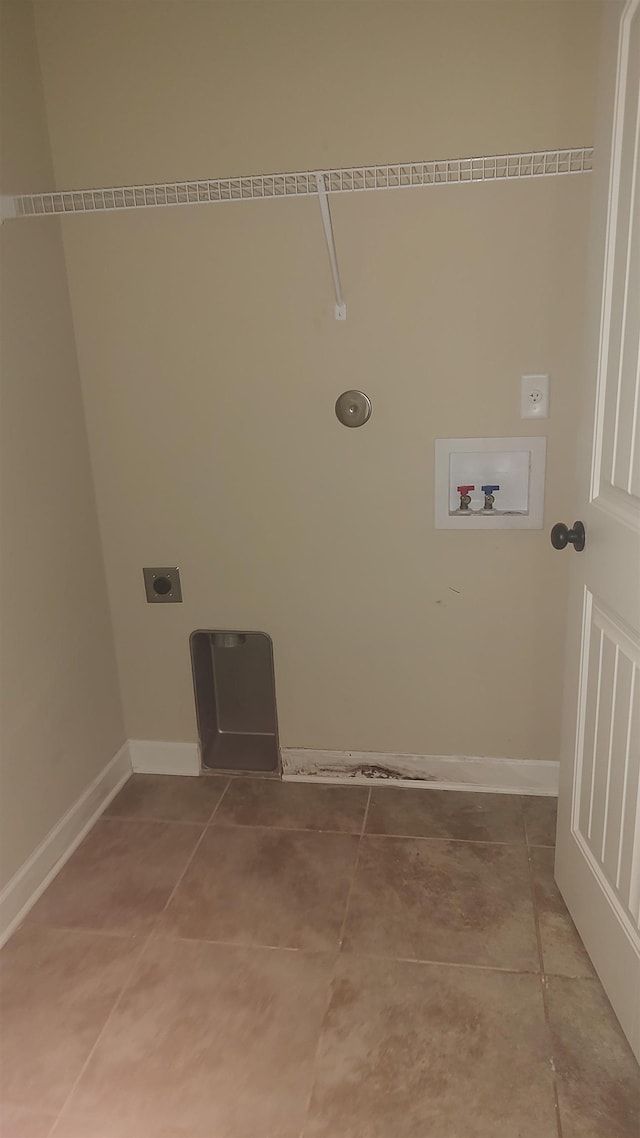 laundry room with light tile patterned floors, hookup for a washing machine, hookup for an electric dryer, laundry area, and baseboards