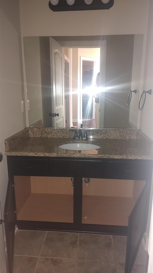 bathroom with vanity and tile patterned floors