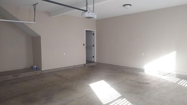 garage featuring baseboards and a garage door opener