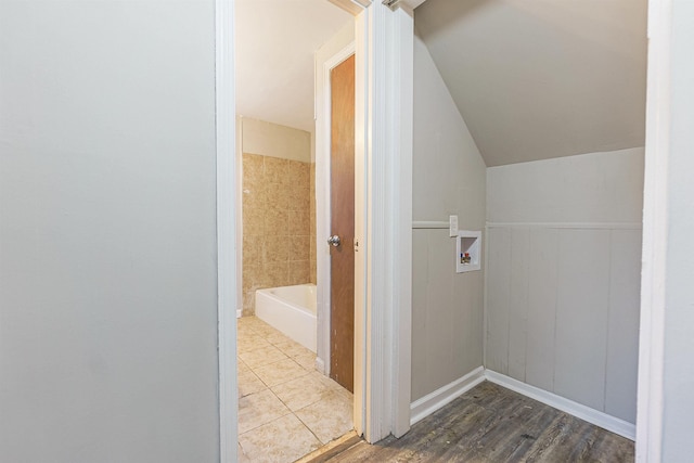 laundry area featuring hookup for a washing machine and hardwood / wood-style flooring