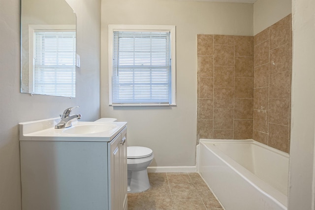 bathroom featuring vanity, tile patterned flooring, and toilet