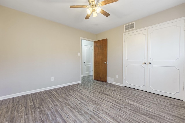 unfurnished bedroom with a closet, ceiling fan, and light hardwood / wood-style flooring