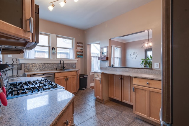 kitchen featuring pendant lighting, dishwasher, sink, ornamental molding, and light stone countertops