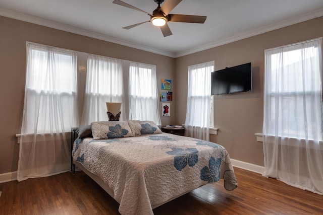 bedroom with multiple windows, crown molding, dark hardwood / wood-style flooring, and ceiling fan