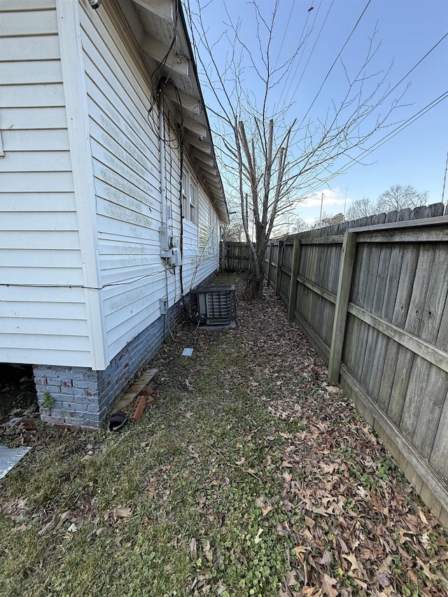 view of yard with central air condition unit