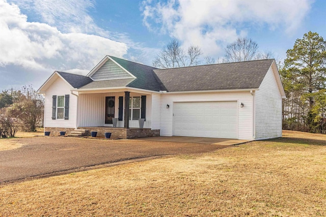 ranch-style house featuring a garage, a front lawn, and a porch