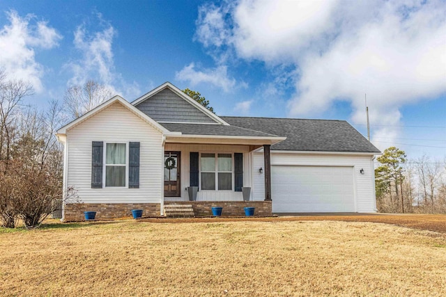 view of front of house featuring a garage and a front lawn