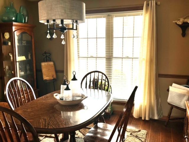 dining area featuring dark hardwood / wood-style floors and a notable chandelier