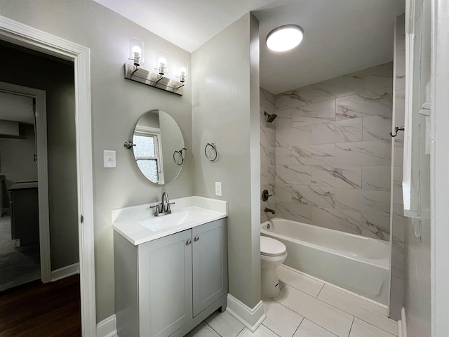 full bathroom with vanity, toilet, and tiled shower / bath combo