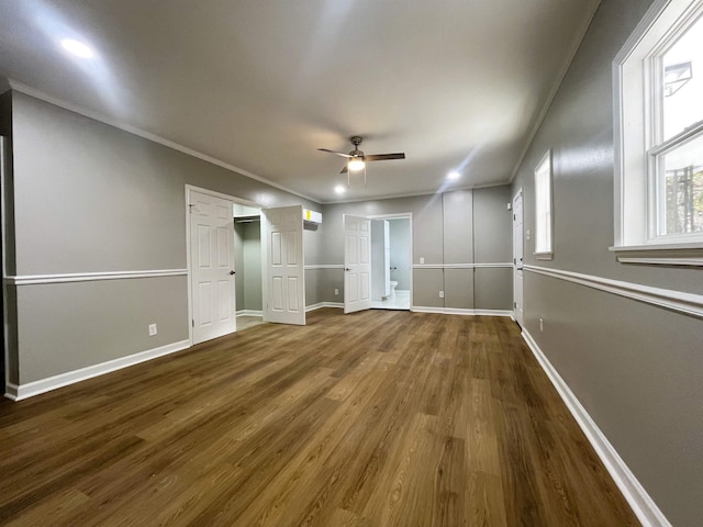 unfurnished bedroom with hardwood / wood-style floors, crown molding, and ceiling fan