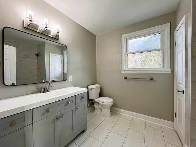 bathroom featuring walk in shower, vanity, and toilet