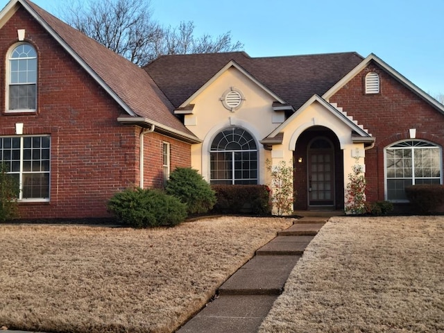 view of front of home with a front lawn