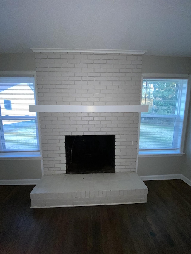 details featuring hardwood / wood-style flooring and a fireplace