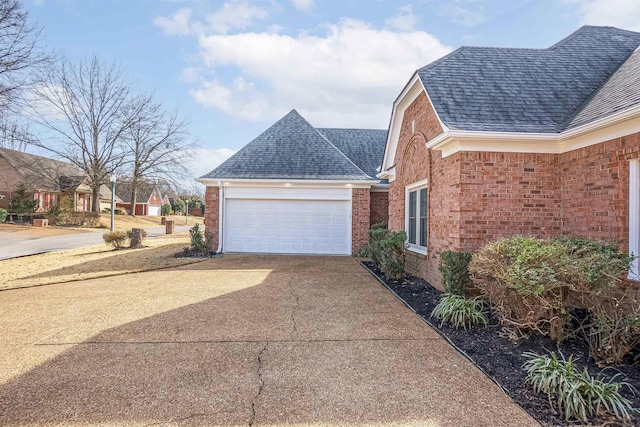 view of side of property with a garage