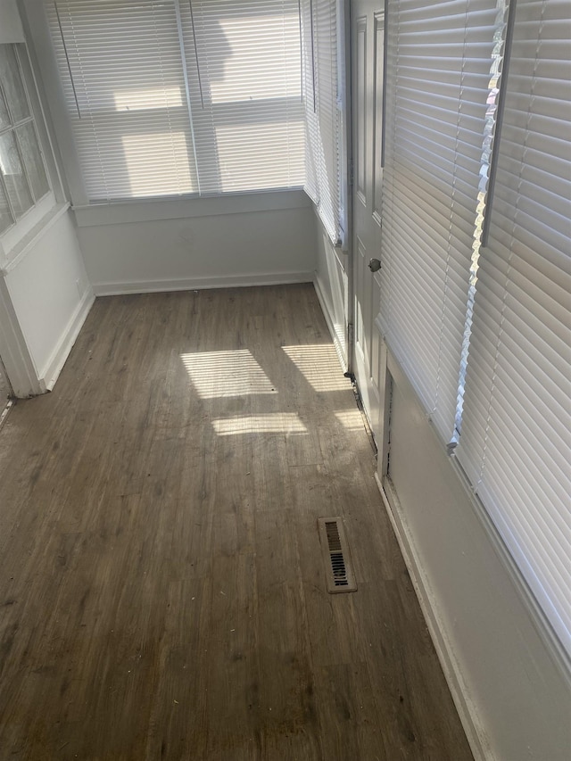 spare room with dark hardwood / wood-style floors