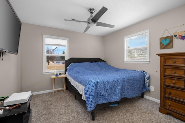 bedroom with light colored carpet and ceiling fan