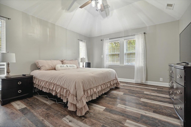 bedroom with vaulted ceiling, dark hardwood / wood-style floors, and ceiling fan