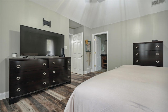 bedroom featuring dark hardwood / wood-style flooring