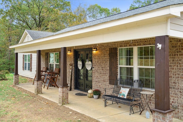 property entrance featuring covered porch