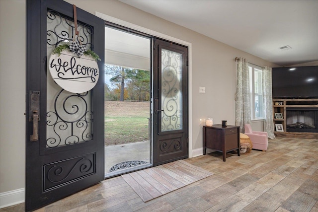 entrance foyer with hardwood / wood-style floors