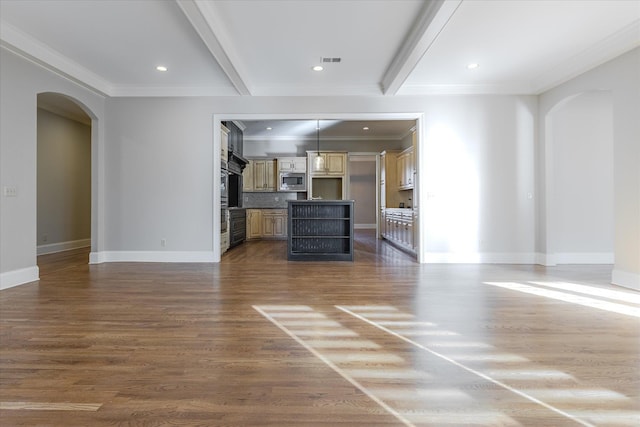 unfurnished living room with dark wood-type flooring, ornamental molding, and beamed ceiling