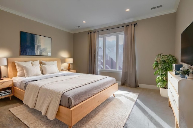 bedroom with light carpet and ornamental molding