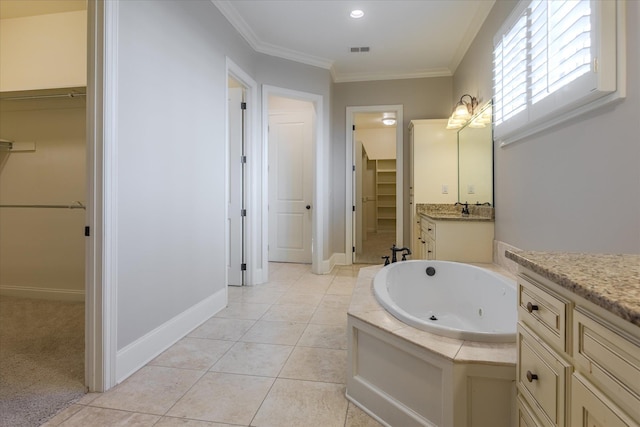 bathroom featuring crown molding, a washtub, vanity, and tile patterned floors