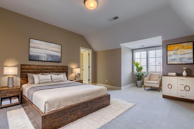 carpeted bedroom featuring vaulted ceiling