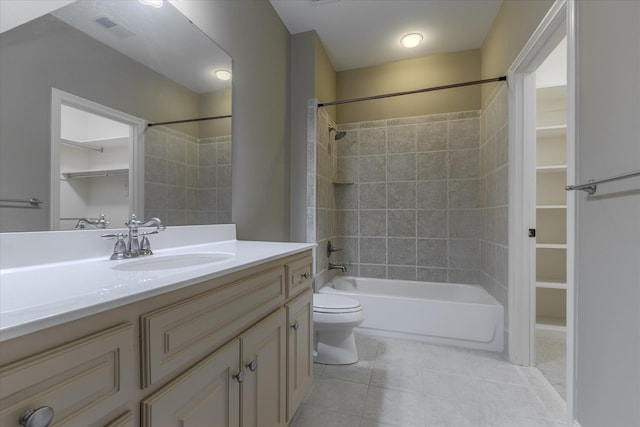 full bathroom with tile patterned floors, vanity, toilet, and tiled shower / bath