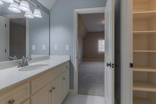 bathroom featuring vanity and vaulted ceiling