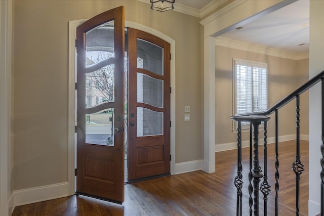 entryway featuring dark hardwood / wood-style flooring and crown molding