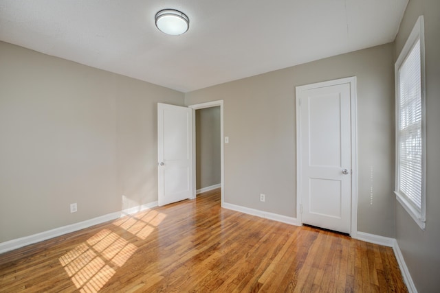 unfurnished bedroom featuring light wood-type flooring