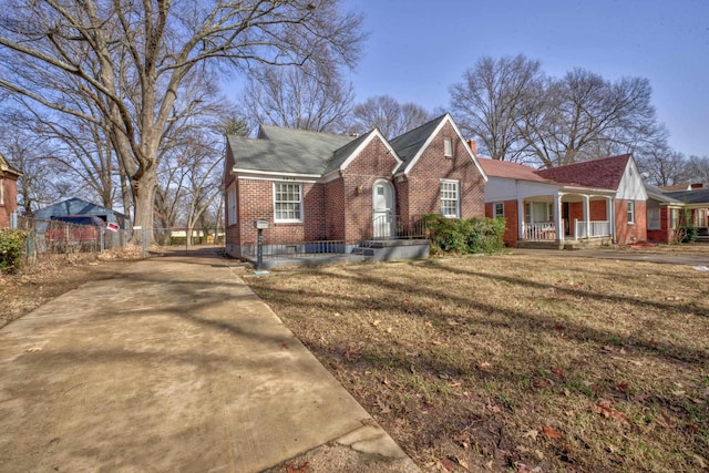 view of front of home with a front yard and covered porch