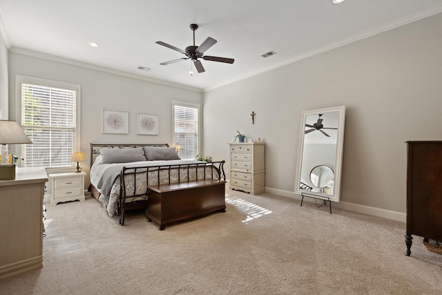 carpeted bedroom featuring ceiling fan, ornamental molding, and multiple windows