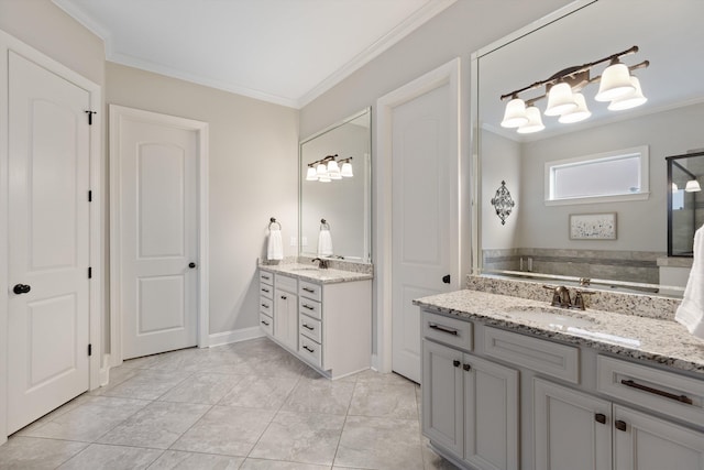 bathroom featuring crown molding, vanity, and tile patterned floors