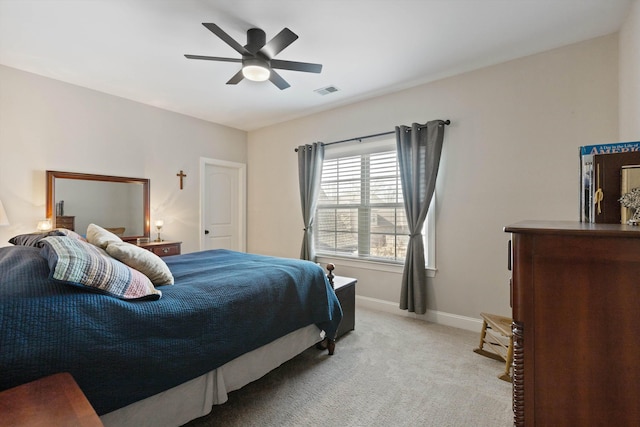 bedroom featuring ceiling fan and light colored carpet