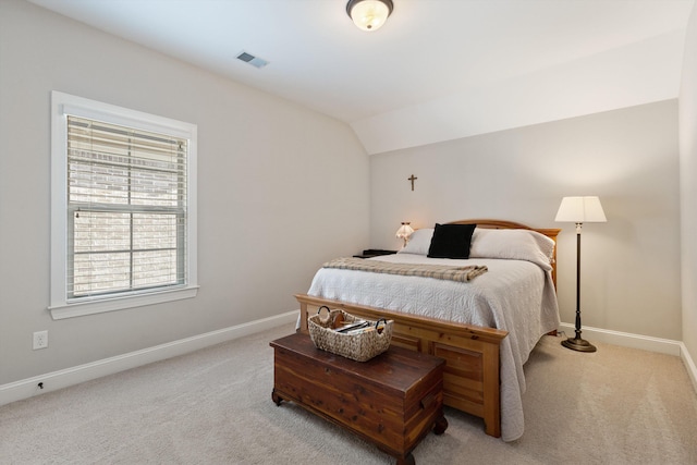 carpeted bedroom featuring vaulted ceiling