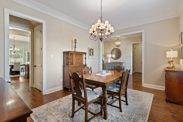 dining room with crown molding, dark wood-type flooring, and a chandelier