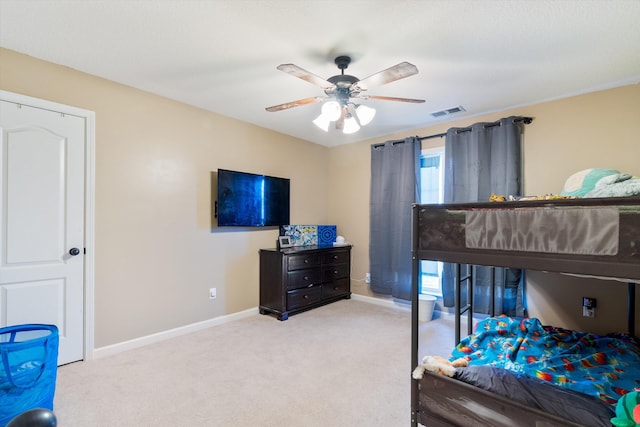 bedroom with light carpet and ceiling fan