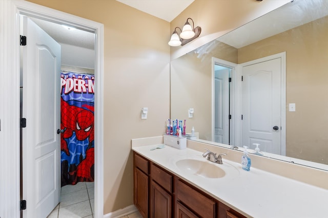 bathroom with vanity and tile patterned flooring